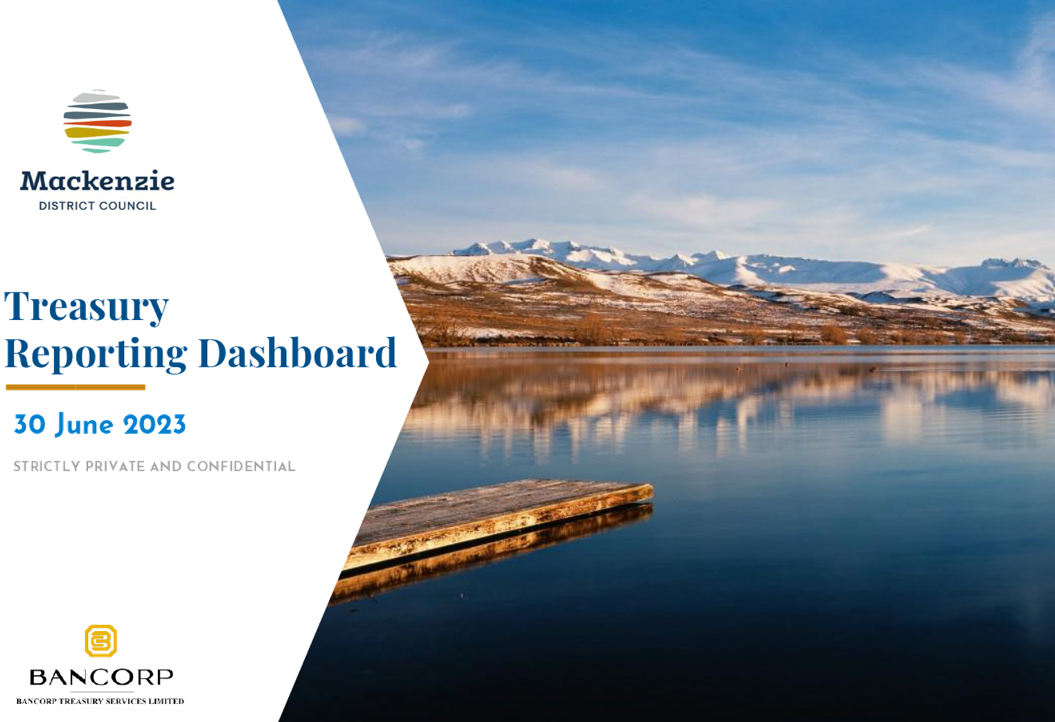 A lake with a dock and mountains in the background

Description automatically generated
